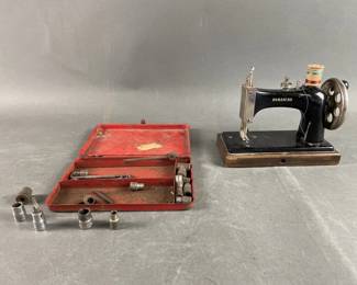 Lot 87 | Vintage Damascus Sewing Machine and More

