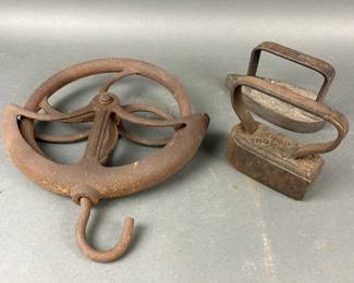 Lot 297 | Antique Sad Irons & Well Pulley
