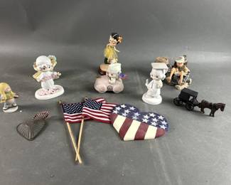 Lot 300 | Vintage Variety Precious Moments, Flags & More
