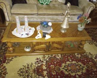 A Full Ivory Sofa, A Coffee Table, and Area Rug, 