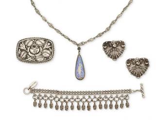 2173
A Group Of Vintage Silver Jewelry
20th century
Each marked for maker; three marked for sterling; one for Indonesia
Five works comprising an English sterling silver necklace with figural morpho butterfly wing pendant, a pair of sterling silver Italianate cherub brooches, a repoussé silver rose brooch, and a Lois Hill sterling silver chain bracelet with filigree drops, 5 pieces
Necklace: 30" L x 2.25" H; bracelet: 7" L x 1.25" H; brooches: 1.75" H x 2.5" W and 1.25" H x 1.375" W
101.1 grams gross
Estimate: $500 - $700