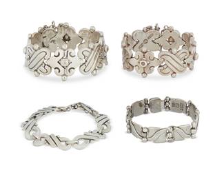 2200
A Group Of Hector Aguilar Mexican Silver Bracelets
Hector Aguilar (1905-1986)
Circa 1940-1945; 1948-1962; Taxco, Mexico
Each stamped: HA [conjoined]; further variously stamped: Taxco / 940 / Sterling / Made in Mexico / [Eagle 9]
Four sterling silver link bracelets in various styles and sizes including two chunky X-form bracelets with dimpled dots, a "Lyre" bracelet with stacked silver balls, and a narrow figure-8 knot-form bracelet, 4 pieces
Largest: 7.25" L x 1.125" H; smallest: 7.75" L x 0.5" H
289.0 grams
Estimate: $700 - $900