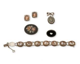 2139
A Group Of Antique-Style Jewelry
20th century
Three marked for sterling; one marked: 800
Five works comprising three diminutive brooches, including an oval onyx pin with a natural pearl, an oval pin with floral stone inlay, a bow brooch with painted miniature oval portrait, as a well as a sterling silver cameo link bracelet, and a pair of sterling silver cameo earrings, 6 pieces
Largest brooch: 1.125" H x 1.5" W; smallest: 0.875" H x 1" W; bracelet: 7.5" L x 0.625" H; each earring: 0.75" H
45.7 grams gross
Estimate: $400 - $600