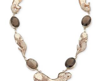 2087
A Sterling Silver Mermaid Necklace
Late 20th/21st century
Clasp stamped: 925
A chunky necklace with multiple mermaid links in carved bone alternating with set faceted smoky quartz
24" L x 1.75" H
135.3 grams gross
Estimate: $300 - $500