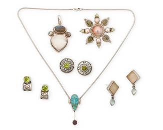 2215
A Group Of Sterling Silver And Gemstone Jewelry
Late 20th/21st century
Four marked for maker and for sterling
Six works comprising a delicate pendant necklace with carved turquoise mask and purple stone drop, a sterling silver pendant with set white drusy and carved labradorite, a pair of Amy Faust "Coke bottle" seaglass and sterling silver earrings with gemstone drops, as well as two pairs of Deb Armstrong sterling silver and peridot earrings, and an unmarked star motif brooch with central pink mabe pearl surrounded by set pearls and green gemstones, 9 pieces
Necklace: 20.5" L x 1.75" H; pendant: 2.25" H x 1.5" W; brooch: 2.25" Dia.; earrings: 1.5" H and 0.875" H
104.6 grams gross
Estimate: $200 - $400