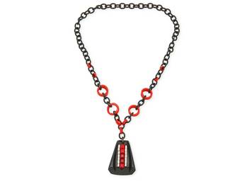 2127
A Bakelite And Rhinestone Necklace
Early/mid-20th century
Unmarked
A chunky necklace with a large black trapezoidal resin pendant set with red and clear rhinestones, suspended from a red and black resin link chain
26" L x 2.5" W
Estimate: $300 - $500