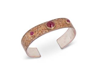 2070
A "Mokume Gane" Mixed Metal And Gemstone Cuff Bracelet
Stamped: MS [conjoined in a circle]
A large "mokume gane" or wood-grain effect sterling silver and mixed metal cuff with three set synthetic ruby cabochons
8.25" total inner C x 0.75" H, with a 1.375" gap
63.7 grams gross
Estimate: $600 - $900