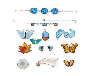 2180
A Group Of Vintage Figural Jewelry
Mid/late 20th century
Ten marked for maker; eleven marked for sterling; five marked for Norway
Twelve works comprising seven Norwegian enamel brooches in various motifs and colors including butterflies, a maple leaf, and a white Balle brooch with abstract motif, and a blue swirl brooch with a pair of matching earrings, together with a sterling silver Margot de Taxco Mexican floral enamel daisy brooch, a blue landscape butterfly pendant, an English delicate link necklace with tropical landscape, and a blue cloisonné enamel link bracelet, 13 pieces
Largest brooch: 1" H x 2.5" W; smallest: 0.75" H x 1.125" W; necklace: 15" L; bracelet: 7.5" L; earrings: 0.75" H
103.8 grams gross
Estimate: $400 - $600