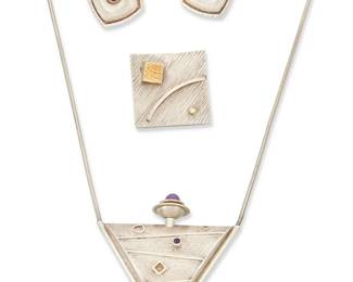 2051
A Group Of Modernist Silver Jewelry
Late 20th/21st century
Each signed for artist and material
Three works comprising a Joseph Downs sterling silver pendant/perfumer with amethyst set plunger, as well as a pair of sterling silver Joseph Downs tourmaline earrings, and a E. Rubio 2000 square brooch in sterling silver and 22K gold, with set diamond, 4 pieces
Necklace: 27" L x 1.875" H; 1.25' H x 1.25" W; each earring: 1" H
56.9 grams gross
Estimate: $400 - $600