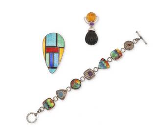 2015
A Group Of Set Stone And Enamel Jewelry
Mid/late 20th/21st century
Two marked for maker and for sterling;
Three works comprising a Mazza/Bartholomew sterling silver slide pendant with set onyx, amethyst and carved amber; a multicolored cloisonné enamel link bracelet with set stones, and a Siam sterling silver and multicolored enamel teardrop brooch, 3 pieces
Pendant: 2" H x 0.875" W; bracelet: 8" L x 0.75" H; brooch: 1.25" H x 2.5" W
45.0 grams gross
Estimate: $200 - $400