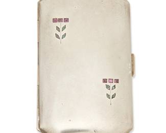 2085
A Vintage German Secessionist Sterling Silver And Gemstone Case
Late 19th/early 20th century
Stamped: 935 / [moon and crown for Germany] / BC [within oval]
A narrow sterling silver rectangular case with set gemstone stylized floral motifs, and with gold-washed interior
3.125" H x 1.875" W x 0.375" D
50.8 grams gross
Estimate: $200 - $300