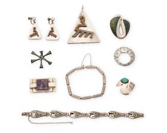 2236
A Mixed Group Of Mexican Silver And Hardstone Jewelry
Mid-20th century
Most variously stamped for maker, for Mexico and for silver; further variously stamped: Taxco / [Eagle 3] / [Eagle 12] / [Eagle 22] / [design number] / Peru; one unmarked
Nine works comprising four sterling silver brooches by makers including Enrique Ledesma, Abraham Paz, and Ana Maria Nunez de Brilanti for Victoria, one with set amethyst and one with greenstone inlay, as well as a Felipe Martinez sterling silver and mixed metal triangular pendant, with a pair of matching earrings, together with two silver link bracelets, one with incised silver fish motif links, and one with silver cylinder links, and a Graziella Laffi single bird earring/clip with green ceramic cabochon eye, 10 pieces
Largest brooch: 2" H x 1.5" W; smallest: 1.5" Dia.; pendant: 3" H x 2.25" W; earrings 1.75" H; bracelets: 7" L and 6.25" L; clip: 1.375" H
141.2 grams gross
Estimate: $200 - $400