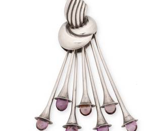 2047
An Antonio Pineda Mexican Silver And Amethyst Brooch
Antonio Pineda (1919-2009)
Circa 1953-1979; Taxco, Mexico
Stamped with crown mark for Antonio Pineda; further stamped: [Eagle 17] / Hecho en Mexico / Silver / 970
A knotted sterling silver brooch/pendant suspending seven silver trumpet dangles tipped with amethyst
4" H x 1.5" W
47.8 grams gross
Estimate: $600 - $800