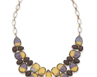 2158
A Sterling Silver And Gemstone Bib Necklace
Late 20th/21st century
Stamped: 925
A large sterling silver bib necklace with cluster-set graduated cut purple and yellow synthetic ametrine and dark purple stones suspended from oval chain links
21.5" L x 2" H
132.5 grams gross
Estimate: $400 - $600