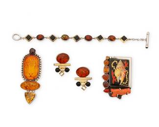 2110
A Group Of Sterling Silver And Amber Jewelry
Late 20th/21st century
Three marked for maker and for sterling; one unmarked
Four works comprising two Amy Kahn Russell sterling silver pendant/brooches, one with a cheetah motif and set amber, and one with a signed Russian painted onyx miniature of a shell, with set branch coral and various stones including amber, as well as a set stone sterling silver link bracelet with set onyx and amber, and a pair of Tricia Young earrings in vermeil sterling silver, with set amber and onyx, 5 pieces
Pendants: 3" H x 1" W and 2.25" H x 1.5" W; bracelet: 7.25" L; earrings: 1.25" H
82.8 grams gross
Estimate: $500 - $700