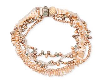 2057
An Amy Kahn Russell Collar Necklace
Late 20th/21st century
Stamped to plaque: AKR
A multistrand necklace of various freshwater pearls and stone beads, with an ornate silver metal magnetic clasp with bezel-set carved bone, pearls and aquamarine
17.5" L x 1.5" H
162.1 grams gross
Estimate: $400 - $600