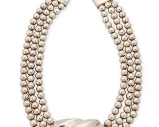 2020
A Patrica Von Musulin Sterling Silver Necklace
Late 20th century
Stamped: Von Musulin / Sterling
A chunky three-strand sterling silver choker with swirled silver central plaque
16" L x 1.25" H
144.3 grams gross
Estimate: $400 - $600