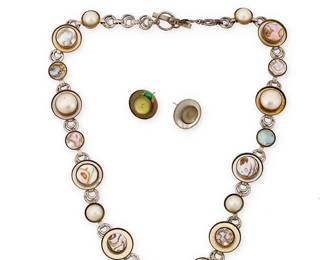 2118
A Mixed Set Of Vintage Jewelry
Mid/late 20th century
Unmarked
Three composite works including a mixed metal link necklace, a similar design link bracelet and a pair of mis-matched earrings, with each metal link centering various set stones including abalone, hematite, and glass cabochons, 4 pieces
Necklace: 20.75" L x 0.75" H; bracelet: 7.5" L; each earring: 0.75" Dia.
Estimate: $300 - $500