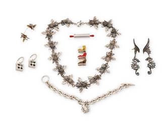 2217
A Group Of Figural Jewelry
Late 20th/21st century
Variously marked for sterling and for maker
Seven works comprising a cast sterling silver bee link necklace, a sterling silver chunky chain link bracelet with frog charm and toggle clasp, two whimsical brooches, one a pendant/brooch entitled: "Imelda's shoe closet," and one in the shape of a vintage rolling pin, as well as four pairs of earrings in various designs including a pair of oxidized sterling silver DVA dragon earrings, a pair of Victoria Varga earrings, and a pair of surreal Linda Hesh earrings, each featuring a seated figure on a flying bird, 10 pieces
Necklace: 18.5" L x 1.25" H; bracelet: 8" L x 1" H; brooches: 2" H and 1.75" H; largest earrings: 3" H; smallest: 0.75" H
195.3 grams gross
Estimate: $800 - $1,200