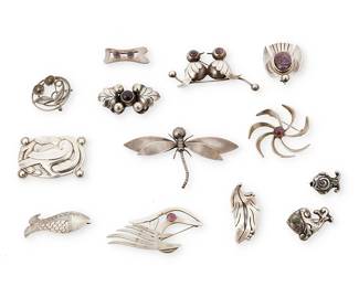 2234
A Group Of Mexican Silver Brooches
Mid-20th century
Each variously marked for Mexico, for sterling, Eagle 3; some variously marked for maker: Coro, Barrera, Isidro Garcia Pina/Maricela, Ambriz, 3M, JH, GCC
Comprising thirteen sterling silver brooches in various figural, foliate and geometric designs, including birds, fish flowers and a dragon fly, some with set amethyst cabochons, and one an articulated brooch with a moveable wing, 13 pieces
Largest: 2.25" H x 4" W; smallest: 0.75" H x 1" W
149.5 grams gross
Estimate: $200 - $400