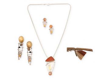 2013
A Group Of Modernist Silver Jewelry
Late 20th/21st century
Each marked for maker and for metal
Four works comprising a Donna McAfee sterling silver and 24k gold pendant/brooch entitled "Golden Accents", with set peach moonstone, and a pair of matching "Golden Accents" earrings, together with an Eileen Sutton sterling silver and 14k gold brooch, and a pair of Sydney Lynch sterling silver vermeil openwork "ladder" earrings, 6 pieces
Necklace: 18" L x 2" H; brooch: 1.25" H x 2.75" W; earrings: 2.5" H and 1.125" H
46.7 grams gross
Estimate: $700 - $900