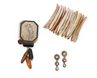 2155
A Group Of Silver And Stone Set Jewelry
Late 20th/21st century
Two marked for maker and for sterling; one marked: CZ
Three works comprising a large Amy Kahn Russell sterling silver octagonal pendant brooch with large set picture jasper, onyx, quartz, and freshwater pearl and onyx drops, as well as an abalone/mother of pearl shell elasticated cuff bracelet, and a pair of Judith Ripka sterling silver and cubic zirconia linear drop earrings, 4 pieces
Pendant: 4.5" H x 2:" W; cuff: 8" inner C [stretched] x 2.75"H; each earring: 1.5" H
Silver: 61.0 grams gross
Estimate: $200 - $400