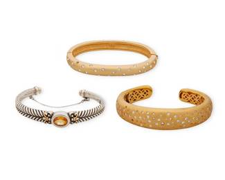 2194
A Group Of Bracelets
Late 20th/21st century
One with swan mark for Swarovski, one marked for sterling and 18K gold; one unmarked
Three works comprising a Swarovski gold-toned metal oval bangle with clasp, a gold-toned bangle with set stones and hinged terminal, and a sterling silver and 18K gold cuff with set citrine and safety chain, 3 pieces
Largest: 6.875" inner C x 0.625" H; smallest: 6.5" inner C x 0.375" H
127.7 grams gross
Estimate: $200 - $300