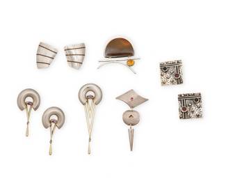 2199
A Group Of Sterling Silver Jewelry
Late 20th/21st century
Four marked for maker; six marked for sterling
Six works comprising a Cindy Calahan modernist sterling silver and "picture jasper" pendant/brooch with set gemstone, and a Joseph Downs sterling silver and gemstone geometric dangle brooch, as well as two pairs of sterling silver earrings, including a pair with copper accent lines by Carolyn Morris Bach and a pair of Echo and the Dreamer gem-set square earrings, together with a vintage sterling silver and amethyst modernist Michou-style brooch with a pair of matching earrings, 9 pieces
Brooches: 3.25" H x 1.25" W; 3" H x 1.5"; 2" x 2"; Earrings: 2.25" H; 1.25" H
82.9 grams gross
Estimate: $500 - $700