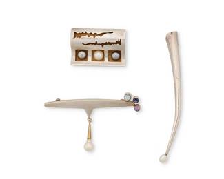 2079
A Group Of Sterling Silver Modernist Jewelry
Late 20th century
Each marked for sterling; two marked for maker
Three works comprising two Michou abstract sterling silver brooches, one rectangular brooch with shadowbox set pearls and abstract cutout motifs, and one sterling vermeil modernist brooch with set gemstones and a pearl dangle, as well as a sterling silver Betsy Fuller delicate tapered trumpet "vase" brooch, 3 pieces
Largest: 3.75" H x 0.375" W; smallest: 1.125" H x 1.625" W
30.9 grams gross
Estimate: $300 - $500