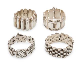 2080
A Group Of Mexican Silver Bracelets Including Hector Aguilar
Four works:

Hector Aguilar (1905-1986)
Circa 1940-1945; Taxco, Mexico
Stamped: HA [conjoined] / Taxco / 940
A chunky sterling silver bracelet with X-form links and curved chevrons with dimpled dots
6.75" H x 1" H

A group of Mexican silver link bracelets
Mid-20th century
Two stamped for Mexico; further variously stamped: Silver / Sterling; one unmarked
Three silver bracelets in various designs including a chunky bracelet with silver oval and scrollwork links, a bracelet with narrow oval links, and a delicate bracelet with five rows of incised silver brickwork links, 3 pieces
Largest: 7.25" L x 1.375" H; smallest: 6.375" L x 1.625" H

4 pieces total
368.2 grams
Estimate: $500 - $700