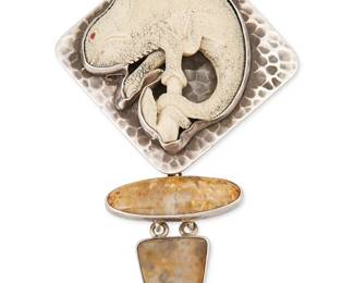 2055
An Amy Kahn Russell Sterling Silver Chameleon Pendant
Late 20th/21st century
Stamped: AKR / Sterling
A hammered silver stacked pendant with carved bone chameleon and set petrified palm wood stones
4.25" H x 2.5" W
47.3 grams gross
Estimate: $200 - $300