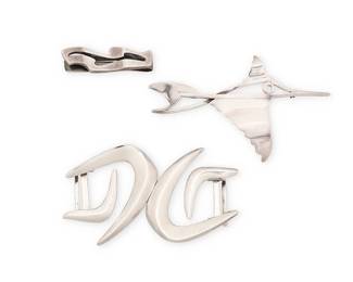 2185
A Group Of Salvador Terán Mexican Silver Jewelry
Salvador Terán (c. 1920-1974)
Circa 1955-1970; Mexico City, Mexico
Each stamped: Salvador / Sterling / Mexico / [Design number]; one further stamped: [Eagle 36]
Three works in sterling silver comprising a silver swordfish brooch (No. 106), an abstract modernist silver two-piece belt buckle (No. 175), and an abstract silver money clip (No. 150), 4 pieces
Largest: 3.75" H x 2.25" W; smallest: 2" H x 0.625" W
65.6 grams
Estimate: $200 - $400