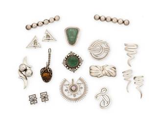 2237
A Large Group Of Mexican Silver And Hardstone Jewelry
Mid-20th century
Each variously stamped for Mexico and for Sterling; seven further variously stamped for maker and design number
Fourteen works comprising ten brooches, including two brooch/pendants, and three with set hardstone, together with a carved tiger's eye sterling silver mask pendant, all in various scrollwork, abstract, and geometric designs, and by various makers including José Anton, Los Castillo, Reveriano Castillo, Pedro Castillo, and Los Ballesteros, 17 pieces
Largest brooch: 0.625" H x 3.5" W; smallest: 1.625" H x 1" W; earrings: largest: 2.125" H; smallest: 0.875" H; pendant: 2" H
268.8 grams gross
Estimate: $200 - $400