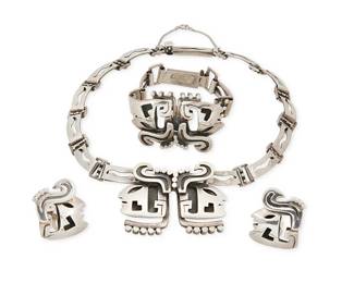 2077
A Set Of Salvador Terán Mexican Silver Jewelry
Salvador Terán (c. 1920-1974)
Circa 1955-1970; Mexico City, Mexico
Each stamped: Salvador / Sterling / Mexico; further variously stamped: Silver / [Design number] 32 / [Eagle 36] / [Eagle 17]
Three works comprising a sterling silver choker link necklace, a matching link bracelet and pair of clip earrings, all in figural and abstract silver overlay motifs, 4 pieces
Necklace: 14.5" L x 1.5" H; bracelet: 6.25" L x 1.375" H; each earring: 1.125" H
127.2 grams
Estimate: $800 - $1,200