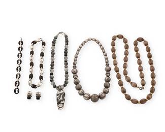 2231
A Group Of Silver Jewelry
Late 20th/21st century
Three marked for maker and for sterling
Six works comprising a signed chunky sterling silver graduated bead necklace, an Ilario sterling silver and carved ebony mariner/anchor link necklace, and a similar design silver and carved ebony mariner link bracelet, as well as a long sterling silver and gold bead opera necklace, a rutilated quartz bead necklace with a long black and white set stone pendant with set gemstone, and a pair of Deborah Armstrong sterling silver and gemstone earrings, 7 pieces
Necklaces: largest: 38" L; smallest: 15.75" L; bracelet: 8.25" L; earrings: 1" H
390.6 grams gross
Estimate: $300 - $500
