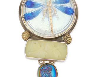 2056
An Amy Kahn Russell Sterling Silver Dragonfly Pendant/Brooch
Late 20th/21st century
Stamped: AKR / Sterling
A stacked pendant/brooch with central opalescent antique dragonfly button set above a carved yellow stone plaque and teardrop blue drusy
3.25" H x 1.75" W
31.0 grams gross
Estimate: $200 - $300
