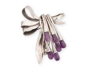 2046
An Antonio Pineda Mexican Silver And Amethyst Brooch
Antonio Pineda (1919-2009)
Circa 1953-1979; Taxco, Mexico
Stamped with crown mark for Antonio Pineda; further stamped: [Eagle 17] / Made in Mexico / PR527
An ornamental sterling silver bow brooch suspending draped trumpet form silver drops tipped with amethyst
3" H x 2.375" W
44.1 grams gross
Estimate: $800 - $1,200