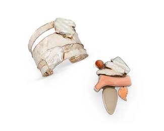 2109
A Mixed Set Of Sterling Silver And Set Stone Jewelry
Late 20th century
Pendant stamped: AKR / Sterling; Cuff stamped: JS / 925;
Two works comprising an Amy Kahn Russell multistone pendant/brooch with set keshi pearl, coral, and clear drusy stones, and a sterling silver and set keshi pearl cuff bracelet, 2 pieces
Cuff: 6.75" total inner C x 2.5" H, with a 1" gap; pendant: 3" H x 2" W
92.6 grams gross
Estimate: $400 - $600