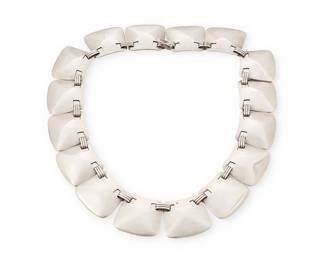 2018
A Hector Aguilar Mexican Silver Necklace
Hector Aguilar (1905-1986)
Circa 1940-1945; Taxco, Mexico
Stamped: HA [conjoined] / Taxco / 940
Comprising a modernist domed square plaque link necklace
15.625" L x 0.875" H
115.2 grams
Estimate: $600 - $800