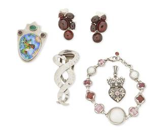 2216
A Group Of Sterling Silver And Gemstone Jewelry
Late 20th/21st century
Three marked for maker; four marked for sterling
Five works comprising a pair of Amy Kahn Russell sterling silver and garnet earrings, an RMD sterling silver, cloisonné enamel and gemstone hummingbird brooch, a Janice Girardi gemstone and mabe pearl link bracelet, a sterling silver crown motif pendant, and a vintage silver metal dress clip with entwined snakes, 6 pieces
Brooches: 2.25" H and 1.75" H; bracelet: 7.25" L; pendant: 1.5" H; each earring: 1.25" H
59.6 grams gross
Estimate: $300 - $500