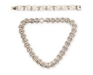 2147
A Group Of Hector Aguilar Mexican Silver Jewelry
Hector Aguilar (1905-1986)
Circa 1940-1945; Taxco, Mexico
Each stamped: HA [conjoined]; further variously stamped 940 / Taxco / Made in Mexico / Sterling
Two works in sterling silver comprising a chunky necklace of incised clipped "coin" links with raised hook elements, as well as a "Lyre" link bracelet with wave form overlay and stacked silver balls, 2 pieces
Necklace: 17" L x 0.625" H; bracelet: 7.125" L x 0.625" H
101.9 grams
Estimate: $400 - $600