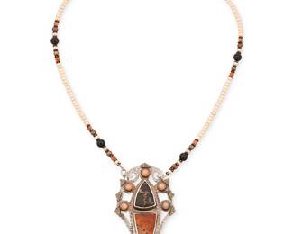 2129
A Tzipora Hoynik Sterling Silver Necklace/Brooch
Late 20th/21st century
Stamped: TH [conjoined] / Sterling / 22k
An elaborate sterling silver and 22k gold pendant/brooch with set stones including moonstones and agates, suspended from a removable gemstone and pearl bead strand necklace
17.25" L x 2.5" H x 1.5" W
30.4 grams gross
Estimate: $300 - $500