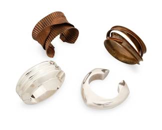 2125
A Group Of Four Bracelets
Mid/late 20th century
Each marked for maker; three for metal
Four works comprising a Nancy Linkin intertwined concave bronze bangle, a Sarah Cavender fluted copper and woven copper mesh cuff bracelet, a Jondell Mexican sterling silver modernist tapered cuff, and a vintage Bayanihan chunky sterling silver hinged oval cuff bangle, 4 pieces
Largest: 7.5" inner C x 1.375" H; smallest: 6.25" inner C x 0.75 " H x 1" D, with a 1.25" gap
Silver: 160.6 grams
Estimate: $600 - $900