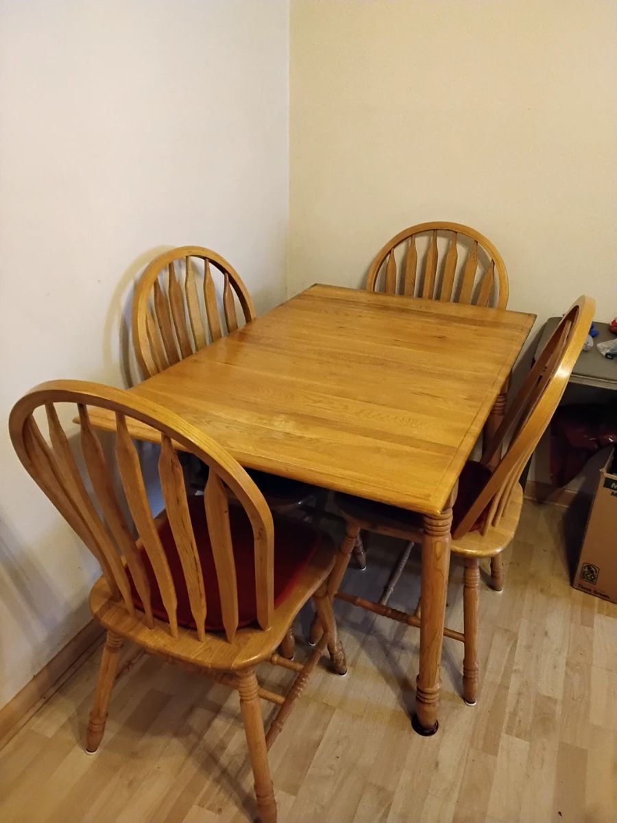 Solid oak drop leaf table with 4 chairs
