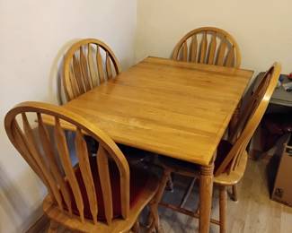 Solid oak drop leaf table with 4 chairs
