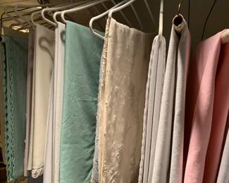 the table linens had all been laundered with plastic coverings, which were removed to show you the selection