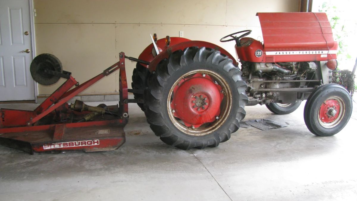Massey Ferguson with brush hog also back blade