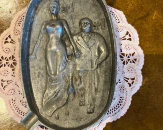 Risqué metal ashtray