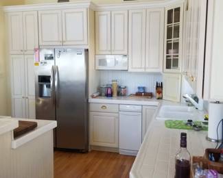 Kitchen cabinetry includes a pantry