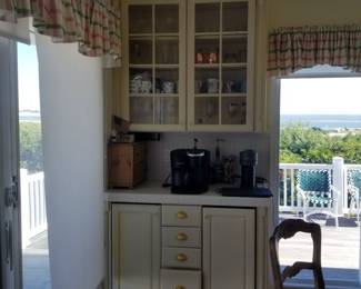 Built-in beverage center matches kitchen cabinetry; features a wine cooler & under-cabinet refrigerator!